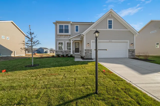 a view of an house with backyard and swimming pool