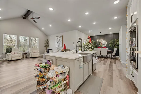 a view of a dining room with furniture and a chandelier