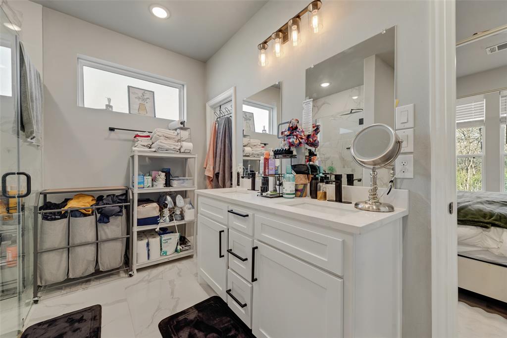 421 Ridgeview Road Sherman, TX 75092 - Photo 22 of 35 a spacious bathroom with a sink double vanity and a mirror
