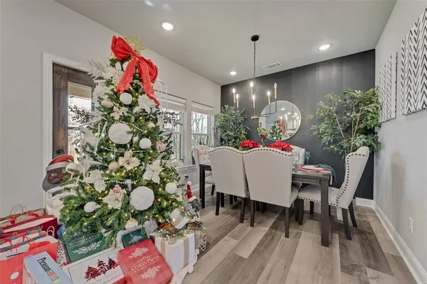 a very nice looking dining room with a table and chairs