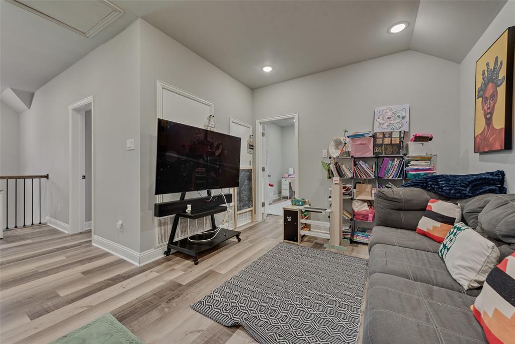 421 Ridgeview Road Sherman, TX 75092 - Photo 27 of 35 a living room with furniture and a flat screen tv