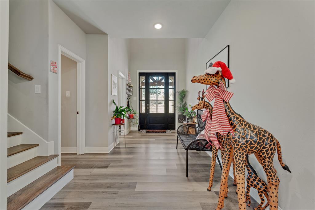 421 Ridgeview Road Sherman, TX 75092 - Photo 7 of 35 a view of a livingroom with wooden floor and stairs