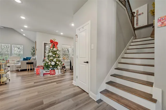a view of entryway with stairs and livingroom with furniture