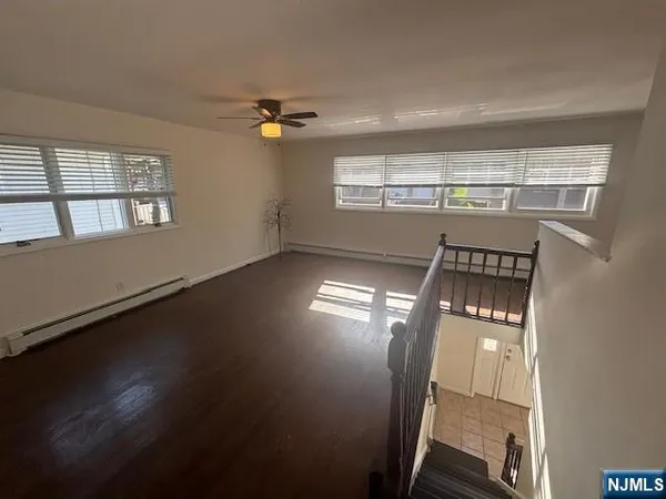 a kitchen with granite countertop stainless steel appliances a stove sink and microwave
