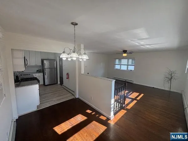 a view of a living room and dining room