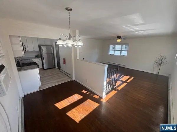 a view of entryway with wooden floor