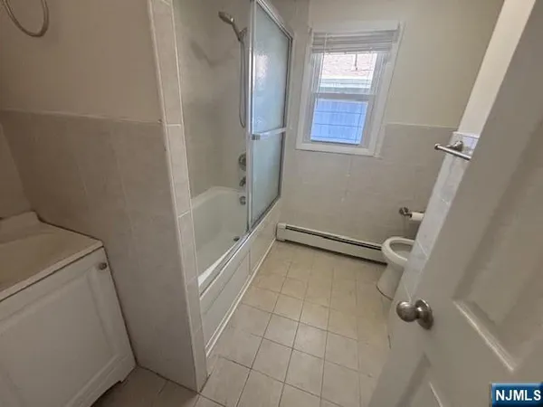 a bathroom with a sink and shower