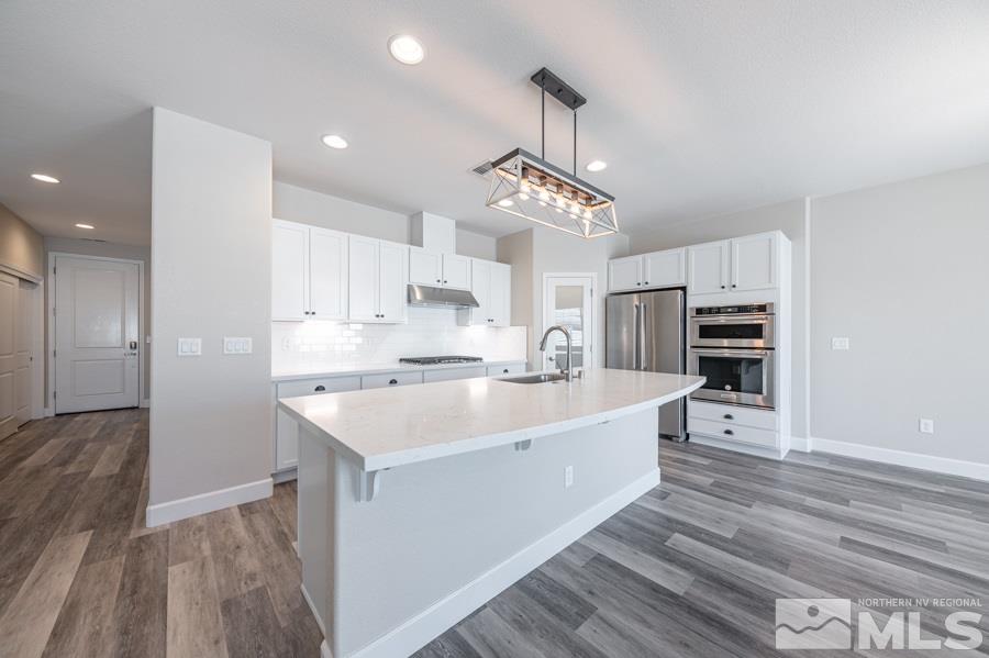 2417 Silver Maple Drive Reno, NV 89521 - Photo 15 of 38 a view of kitchen with stainless steel appliances refrigerator oven and cabinets