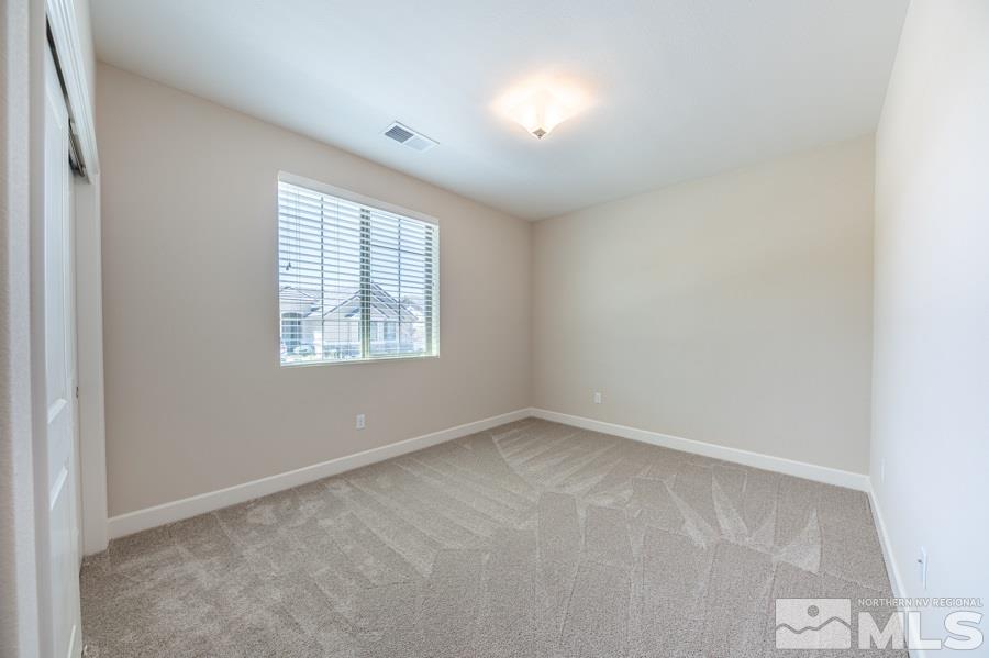 2417 Silver Maple Drive Reno, NV 89521 - Photo 22 of 38 an empty room with windows