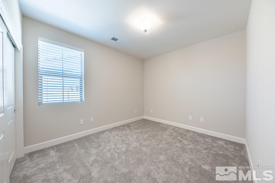 2417 Silver Maple Drive Reno, NV 89521 - Photo 23 of 38 an empty room with a window