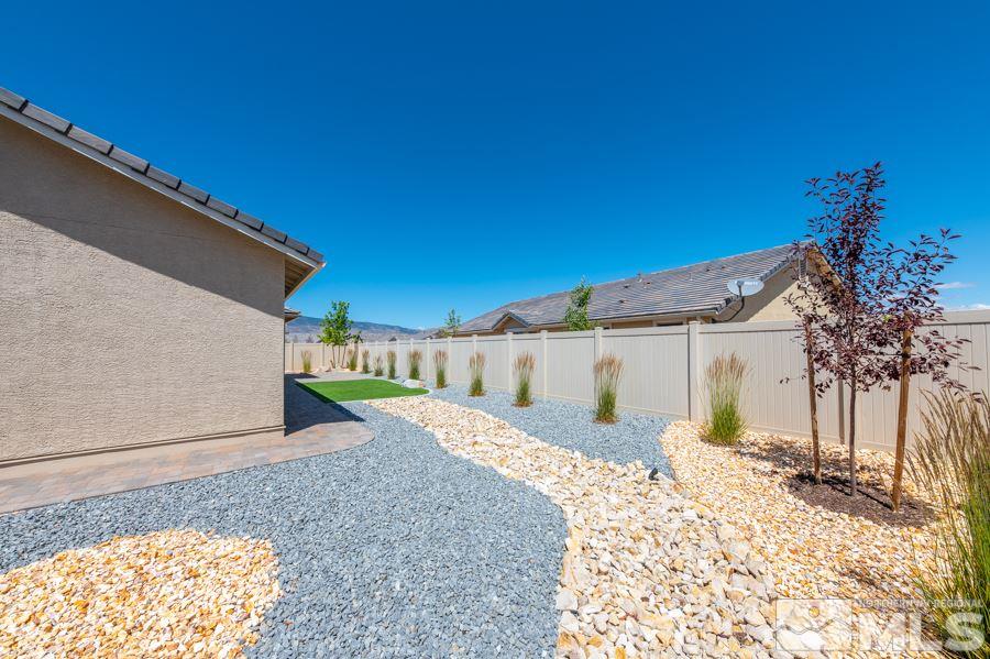 2417 Silver Maple Drive Reno, NV 89521 - Photo 29 of 38 a front view of a house with a yard