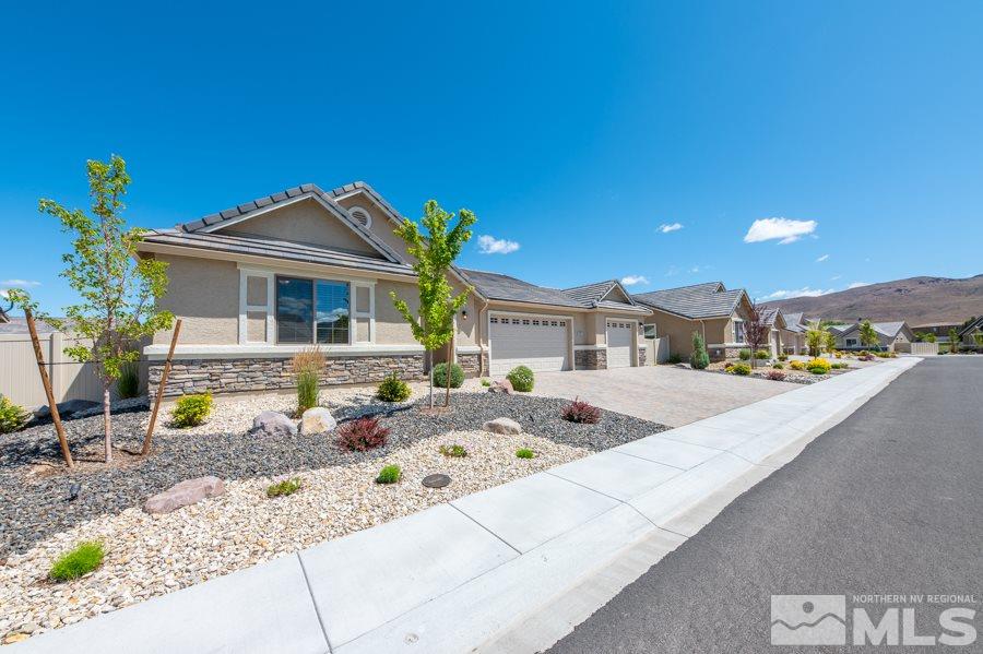 2417 Silver Maple Drive Reno, NV 89521 - Photo 5 of 38 a front view of a house with a yard