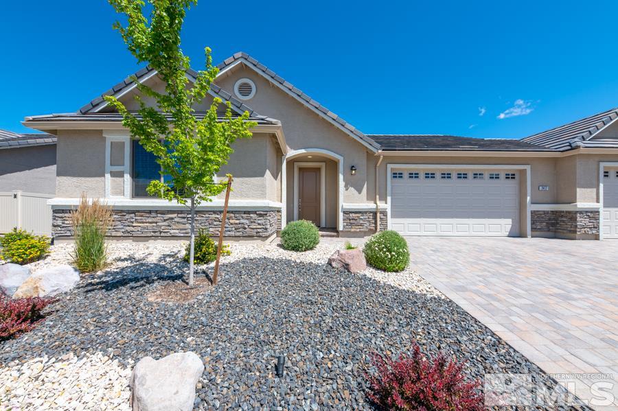 2417 Silver Maple Drive Reno, NV 89521 - Photo 7 of 38 a front view of a house with garden