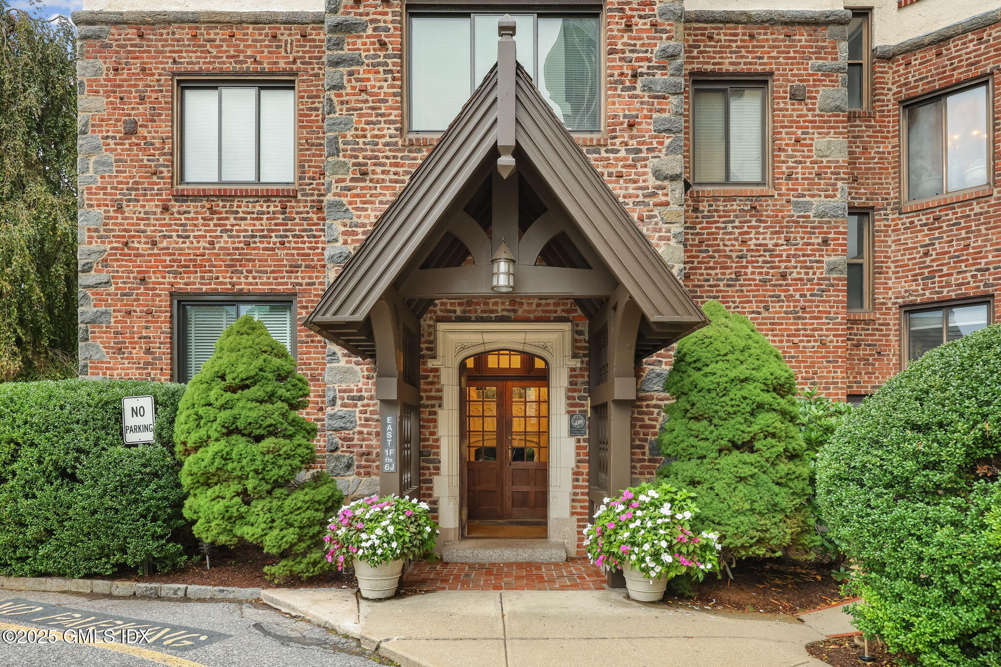 front view of a house with potted plant