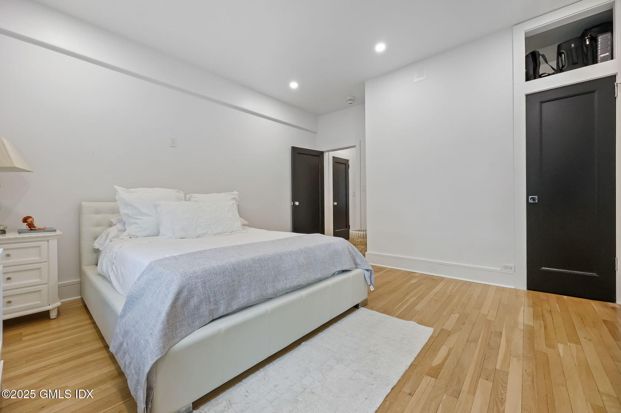 47 Lafayette Place, Unit 1H Greenwich, CT 06830 - Photo 19 of 23 a bedroom with a bed and closet