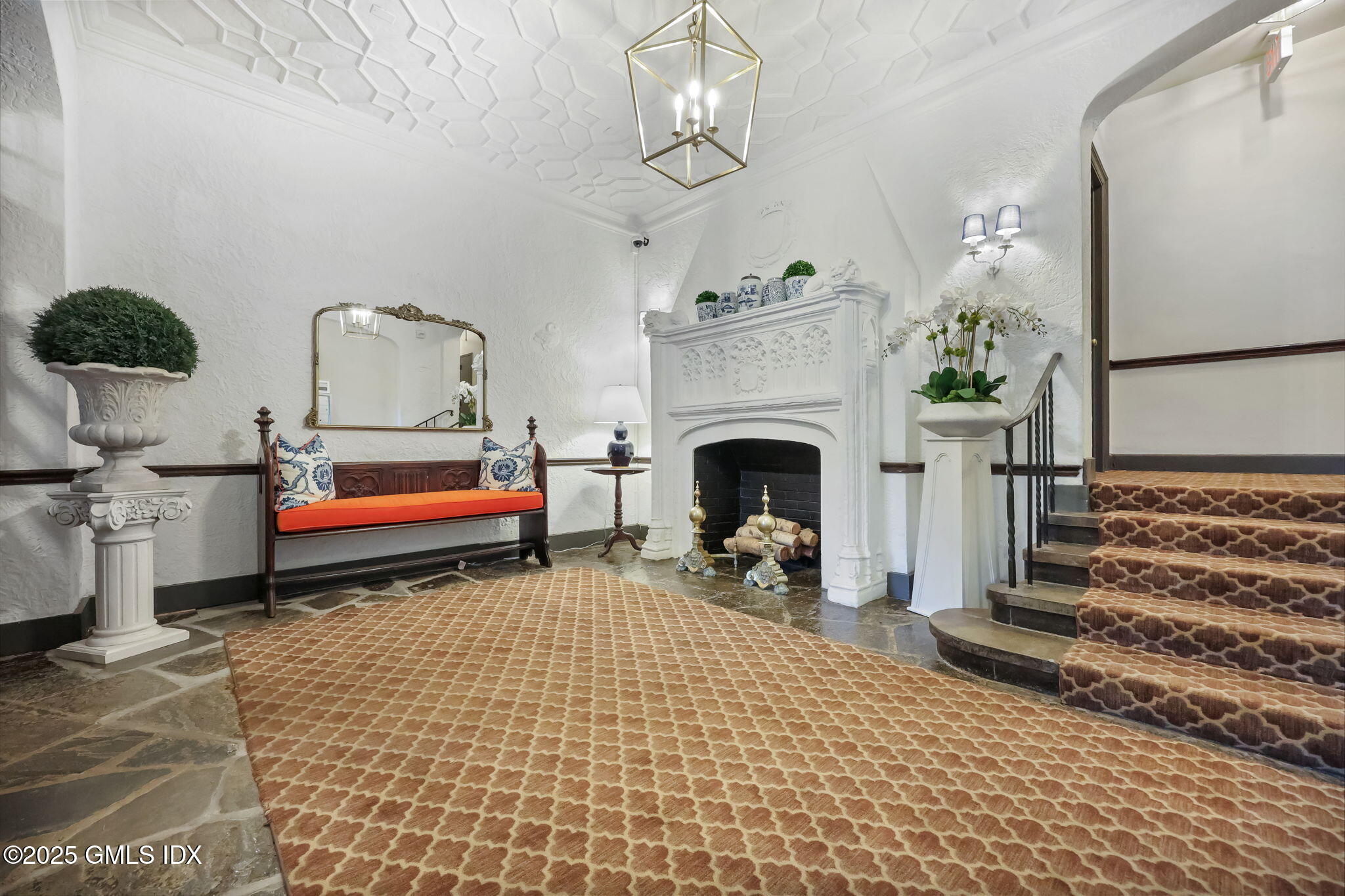 47 Lafayette Place, Unit 1H Greenwich, CT 06830 - Photo 21 of 23 a living room with furniture and a fireplace