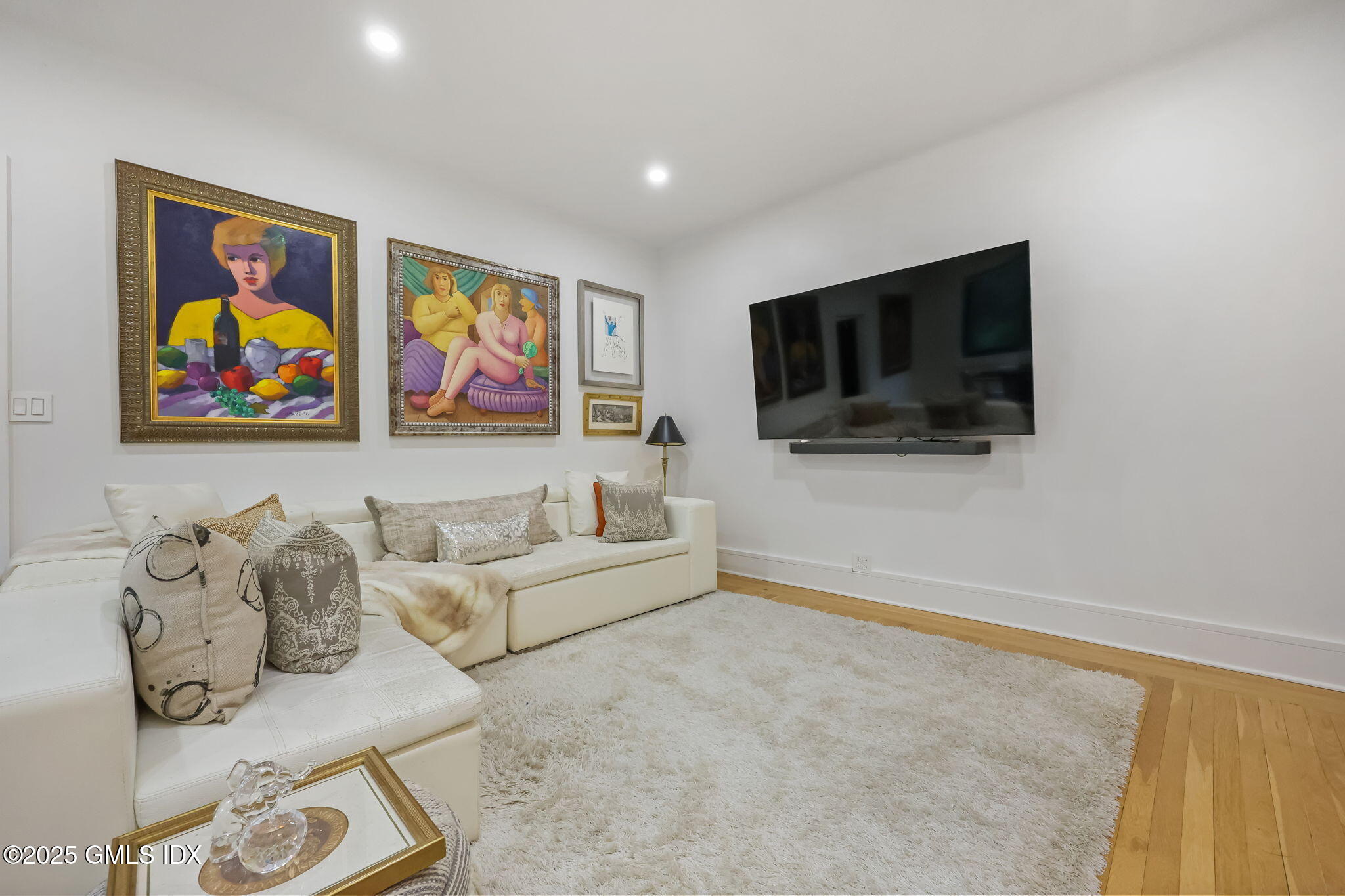 47 Lafayette Place, Unit 1H Greenwich, CT 06830 - Photo 3 of 23 a living room with furniture and a flat screen tv