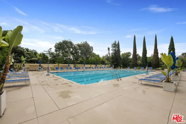 a view of swimming pool from a balcony