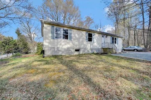 a view of a house with a big yard