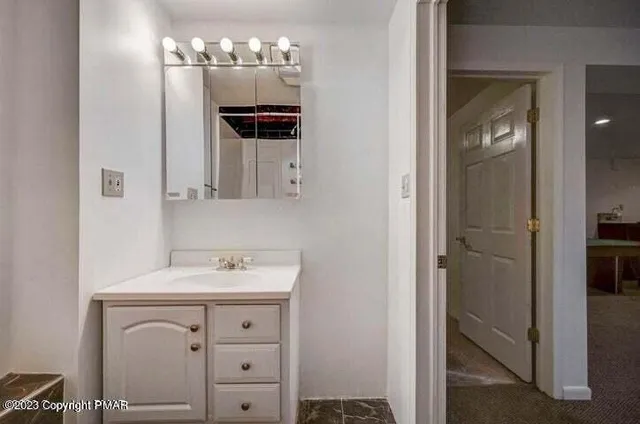 a view of balcony with wooden floor and fence