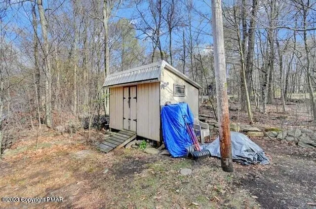 a kitchen with stainless steel appliances granite countertop a refrigerator sink and wooden floor
