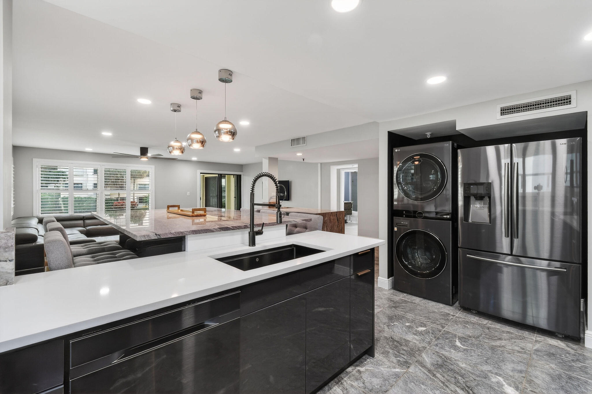 372 Golfview Road, Unit 201 North Palm Beach, FL 33408 - Photo 11 of 45 a kitchen with sink refrigerator and stove