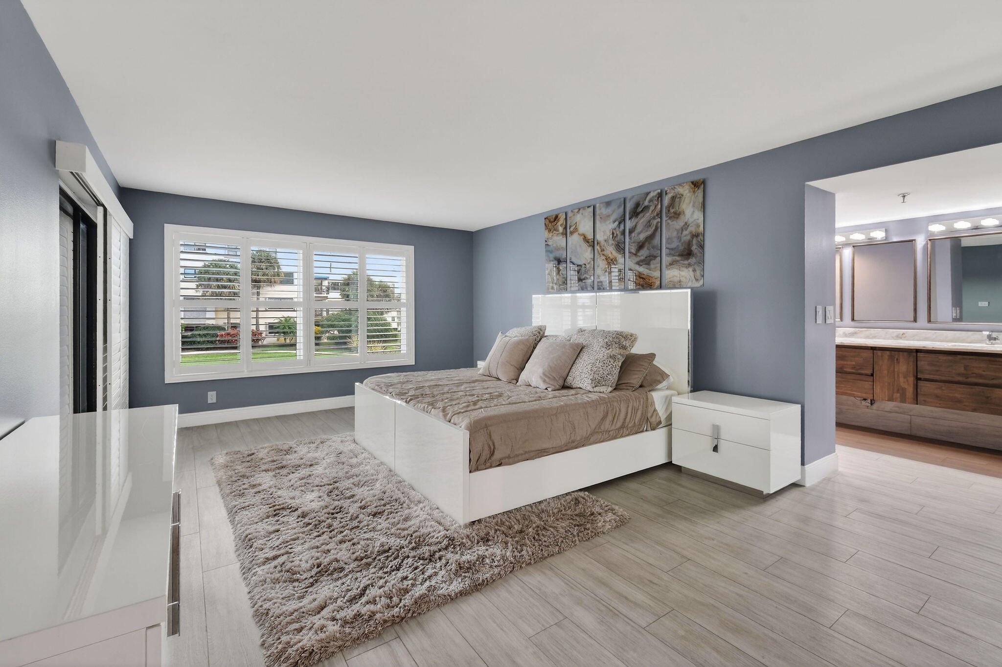 372 Golfview Road, Unit 201 North Palm Beach, FL 33408 - Photo 14 of 45 a living room with furniture and a large window