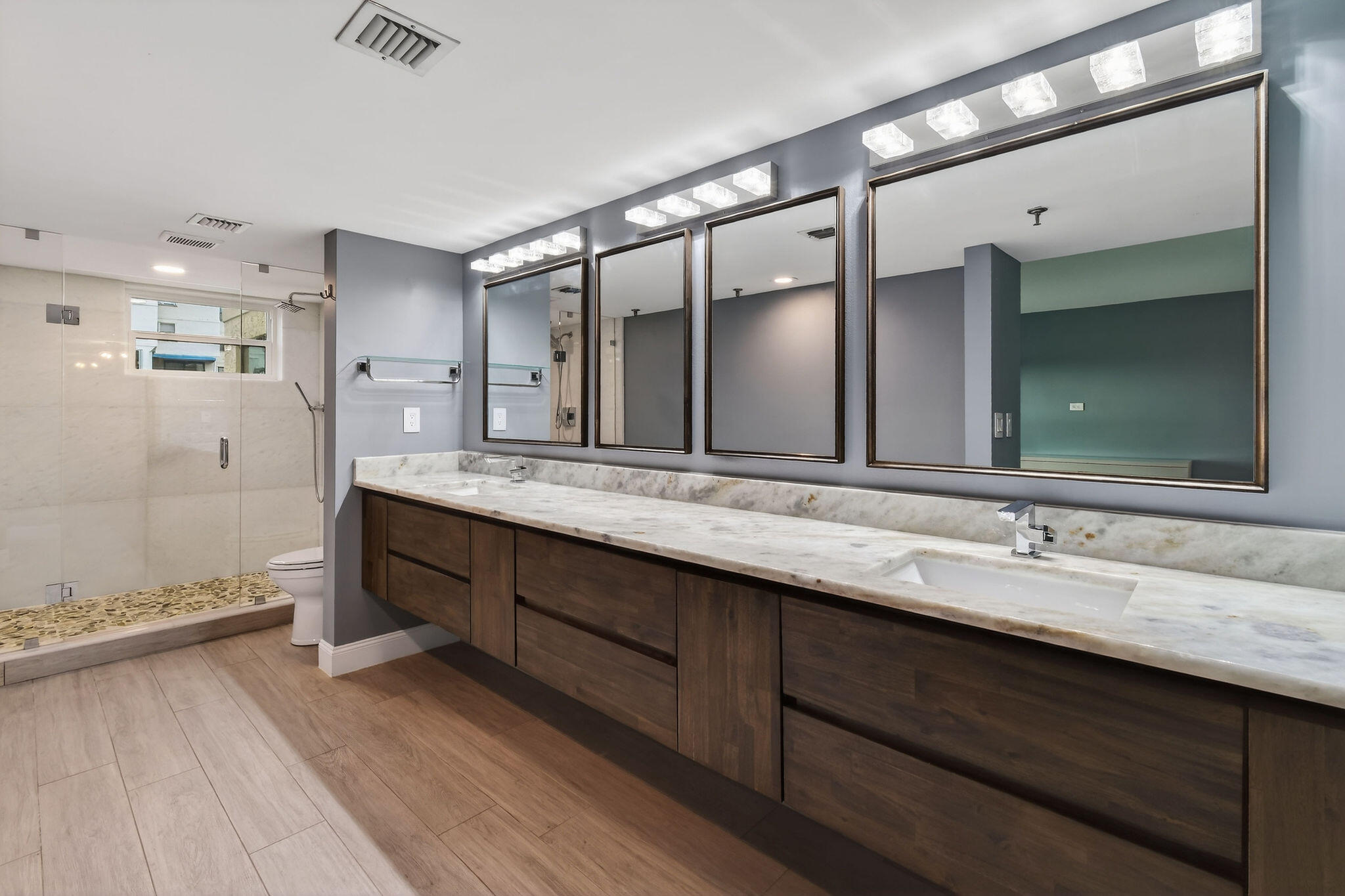 372 Golfview Road, Unit 201 North Palm Beach, FL 33408 - Photo 20 of 45 a bathroom with a double vanity sink and a mirror
