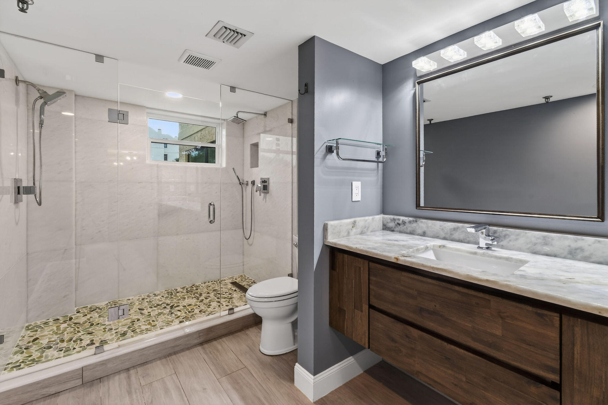 372 Golfview Road, Unit 201 North Palm Beach, FL 33408 - Photo 21 of 45 a bathroom with a granite countertop sink toilet and shower