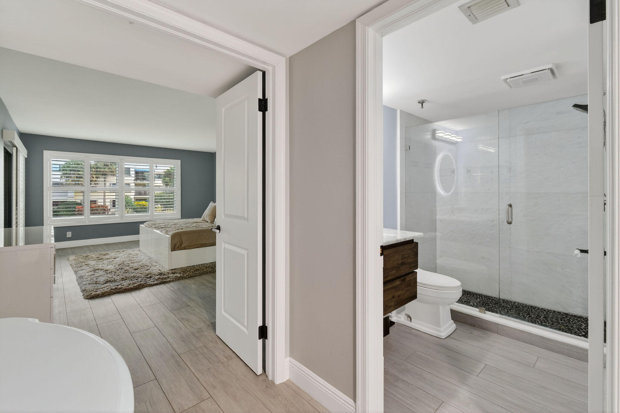 372 Golfview Road, Unit 201 North Palm Beach, FL 33408 - Photo 24 of 45 a bathroom with a granite countertop sink a toilet and shower