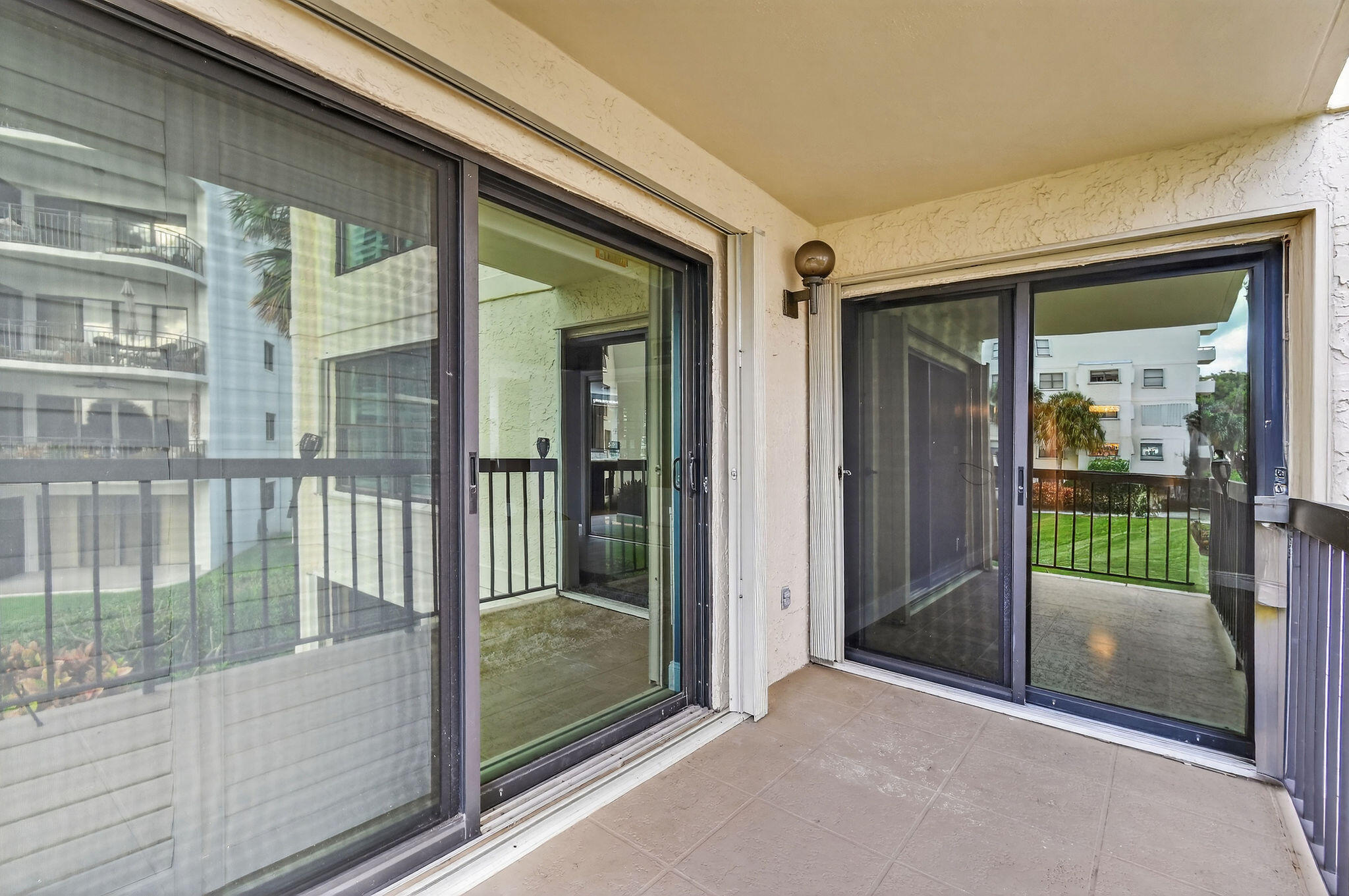 372 Golfview Road, Unit 201 North Palm Beach, FL 33408 - Photo 36 of 45 a view of a glass door and the balcony