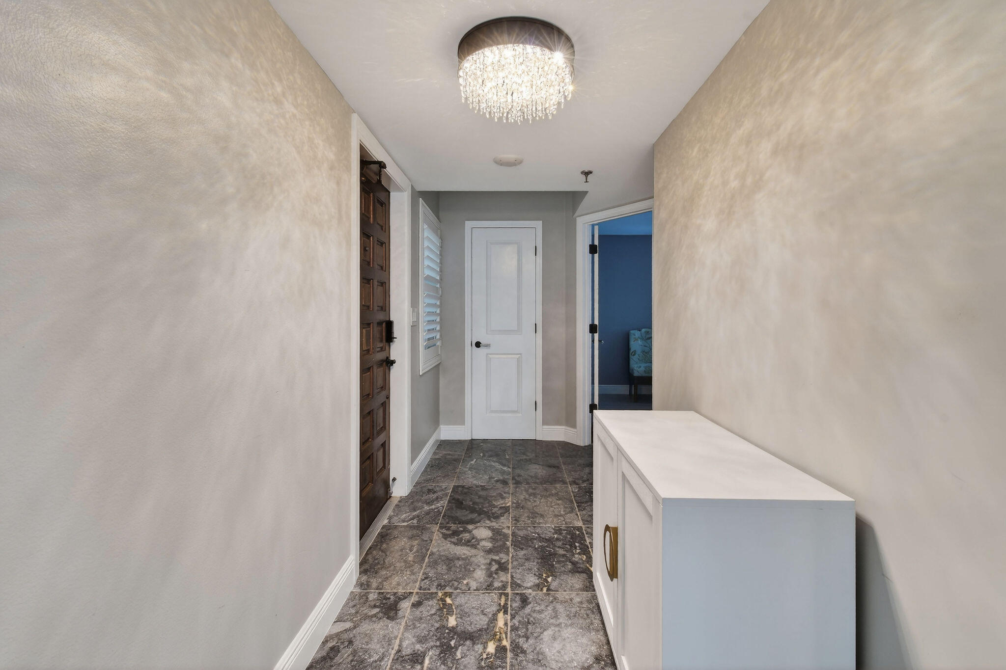 372 Golfview Road, Unit 201 North Palm Beach, FL 33408 - Photo 38 of 45 view of a hallway with a chandelier