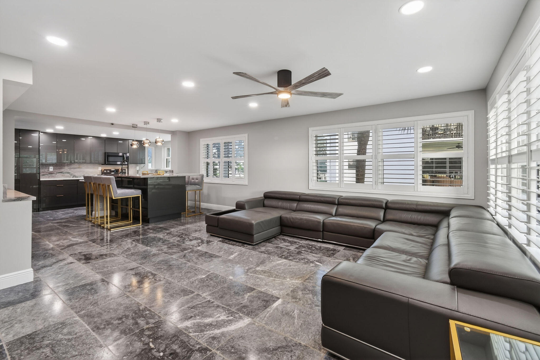 372 Golfview Road, Unit 201 North Palm Beach, FL 33408 - Photo 5 of 45 a living room with furniture and kitchen view