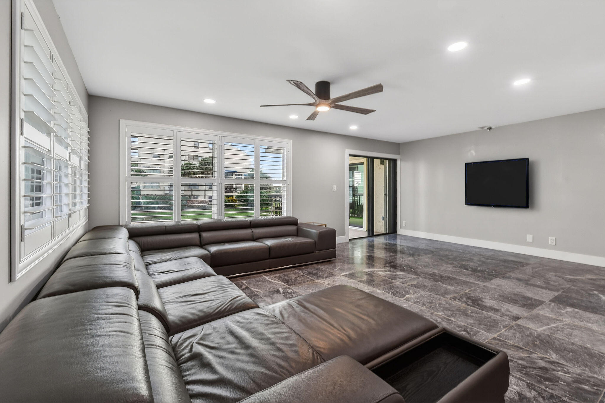 372 Golfview Road, Unit 201 North Palm Beach, FL 33408 - Photo 6 of 45 a living room with furniture and a flat screen tv