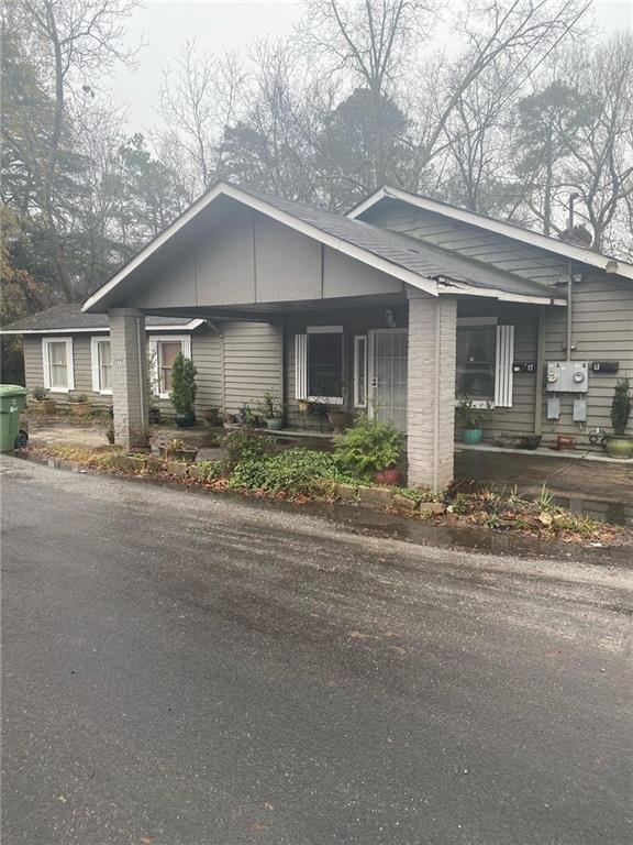 3996 Campbellton Road Southwest Atlanta, GA 30331 - Photo 1 of 1 front view of a house with a street