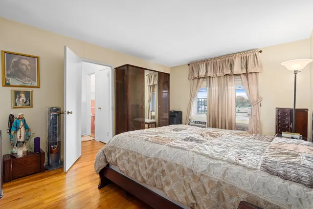 a spacious bedroom with a bed and a walk in closet