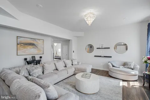 a kitchen with stainless steel appliances granite countertop a sink refrigerator and cabinets