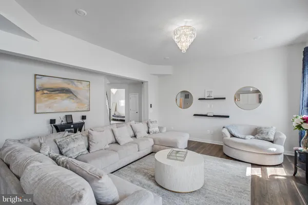 a kitchen with stainless steel appliances granite countertop a sink refrigerator and cabinets