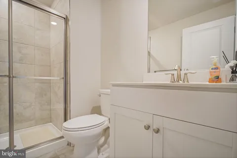 a bathroom with a bathtub and next to a window