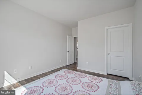 a bathroom with a sink toilet and a mirror