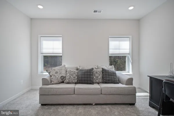 a bedroom with a large bed and a flat screen tv