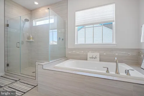 a white toilet sitting next to a white sink