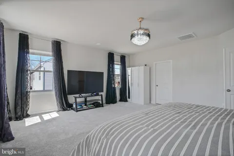 a bedroom with a bed and a cabinets