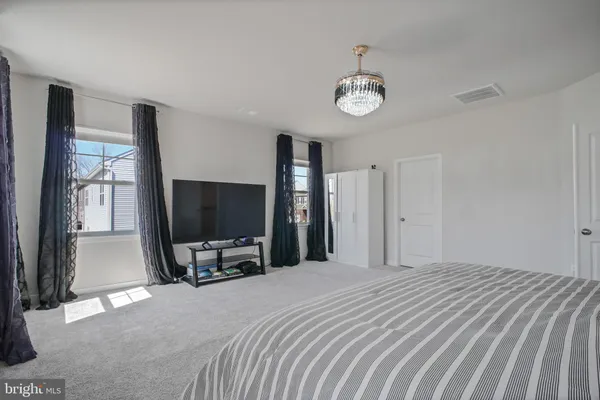 a bedroom with a bed and a cabinets