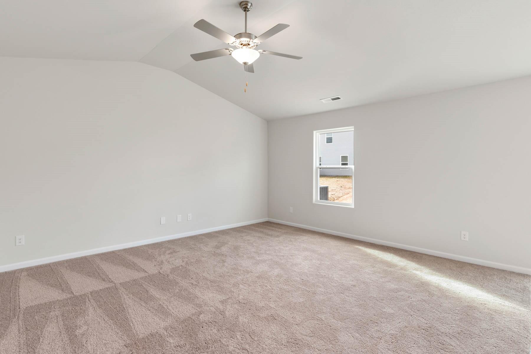 1241 Nia Road Charlotte, NC 28215 - Photo 3 of 17 an empty room with a window and a fan