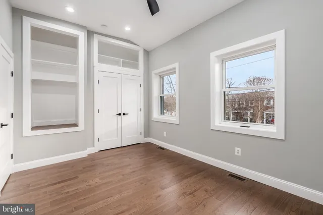 a bathroom with a sink toilet and mirror