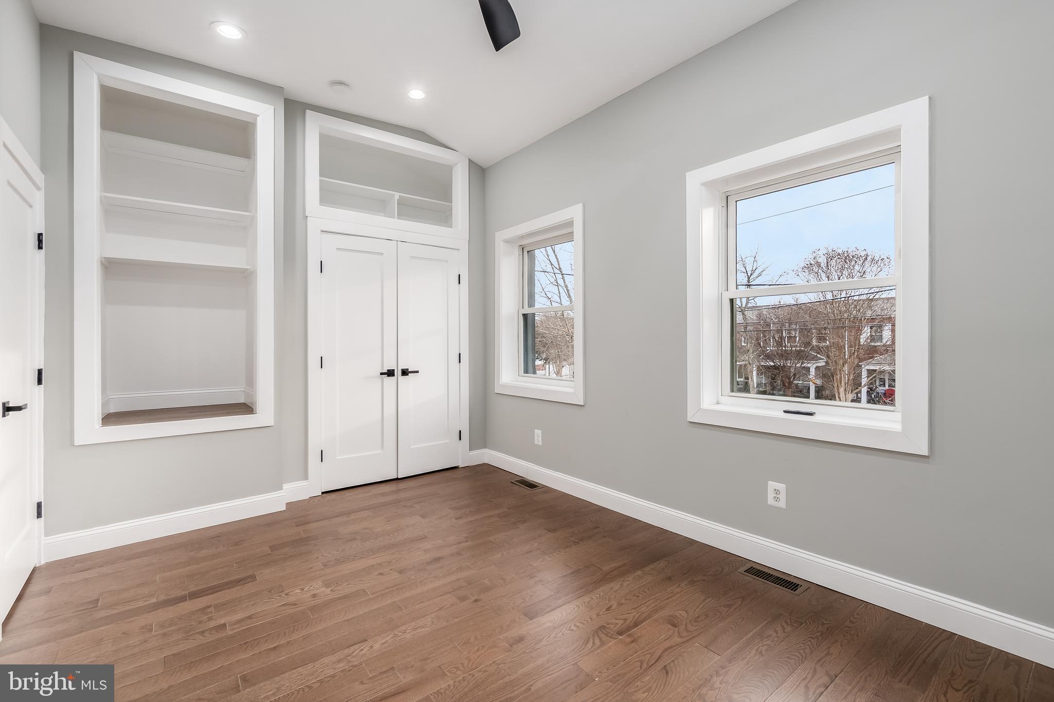 928 Perry Place Northeast Washington, DC 20017 - Photo 19 of 36 a view of an empty room with a window and wooden floor