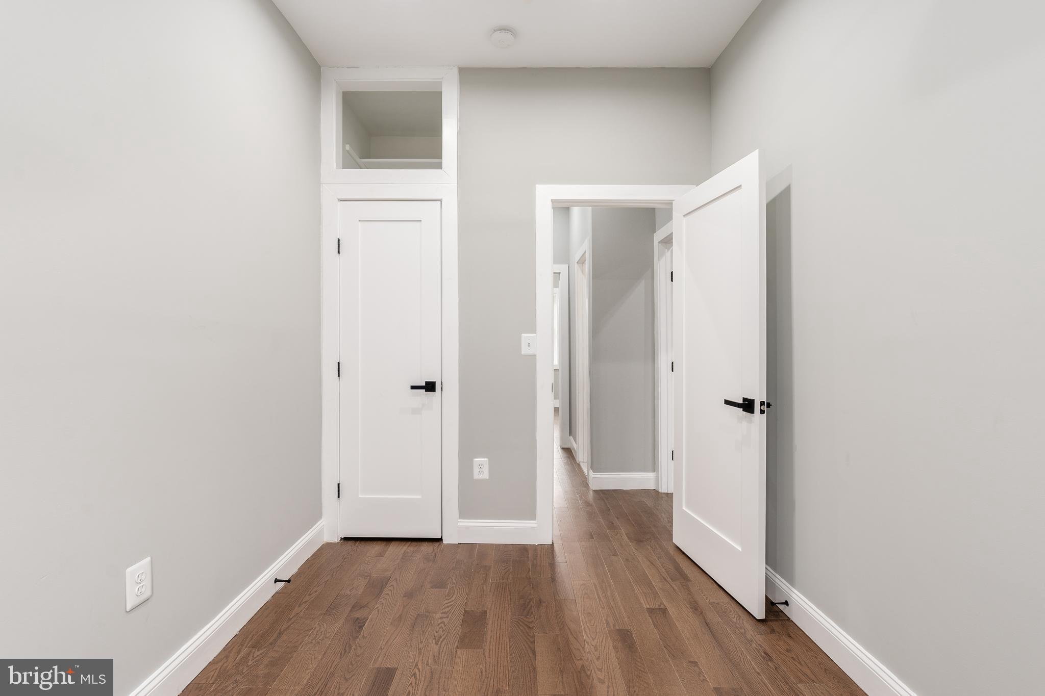 928 Perry Place Northeast Washington, DC 20017 - Photo 23 of 36 a view of a hallway with wooden floor