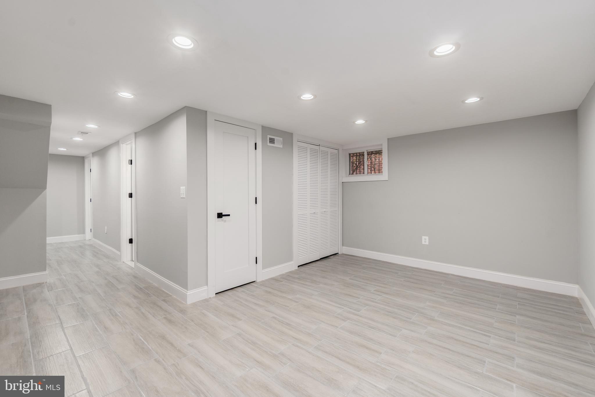 928 Perry Place Northeast Washington, DC 20017 - Photo 29 of 36 a view of an empty room with wooden floor