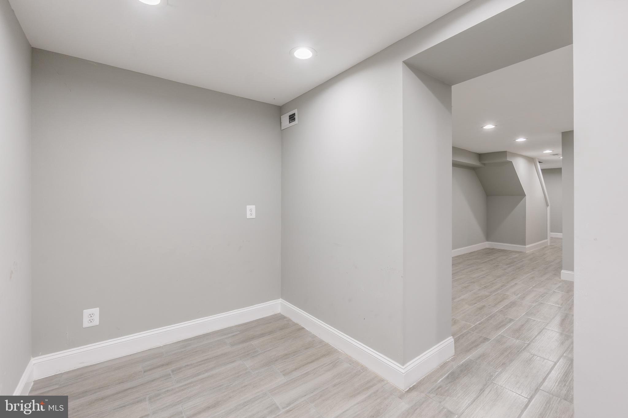 928 Perry Place Northeast Washington, DC 20017 - Photo 32 of 36 a view of hallway with wooden floor